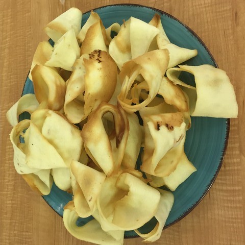 A plate of cookies made of fortune cookie dough but shaped like Mobius strips